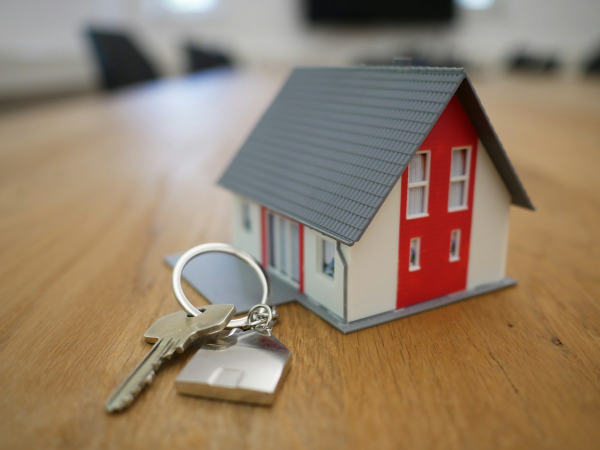 Landlord handing apartment keys to a tenant on move-in day